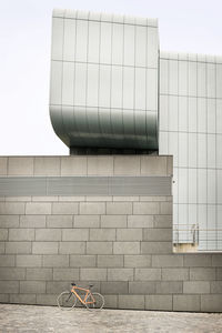 Bicycle at a wall in the city