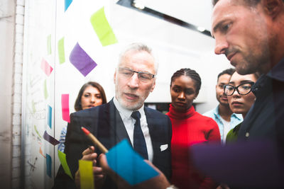 Business colleagues stacking hands