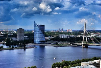 Cityscape against cloudy sky