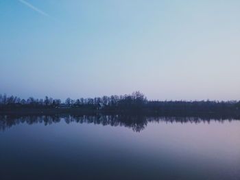 Scenic view of calm lake against clear sky