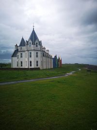 House on field against sky