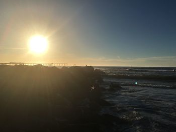 Scenic view of sea against sky at sunset