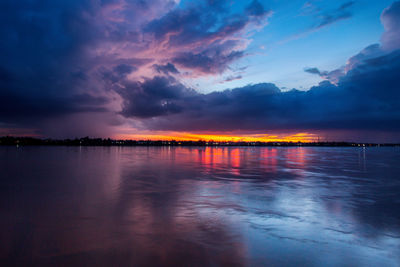 Scenic view of sea against romantic sky at sunset