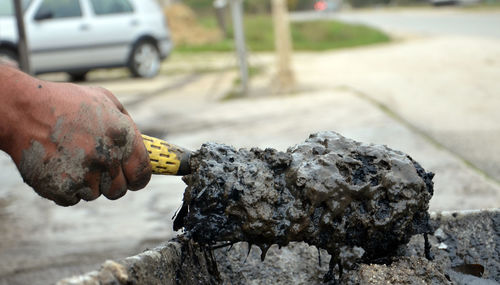 Close-up of hand holding dirt