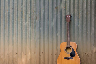 Guitar on corrugated iron