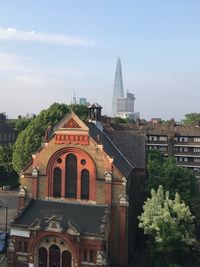 View of buildings in city against sky