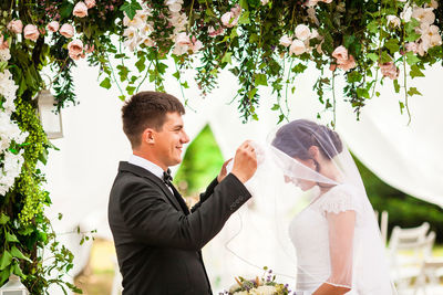 Couple kissing girlfriend