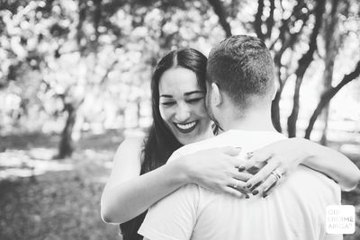 Young couple kissing in park