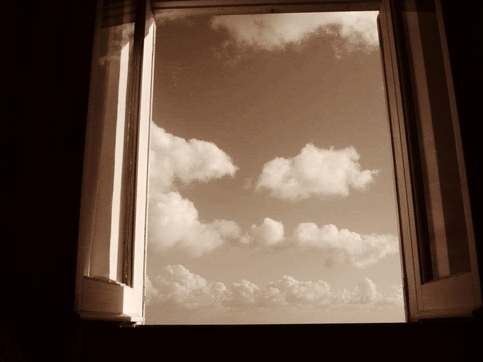 WINDOW AGAINST SKY SEEN THROUGH WINDOWS