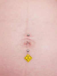 Close-up of human hand against colored background