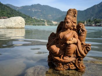 Statue of idol against mountain