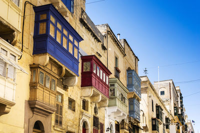 Low angle view of buildings against clear sky