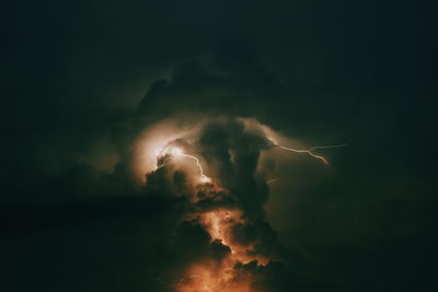 Low angle view of lightning against cloudy sky