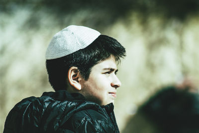 Portrait of young man looking away