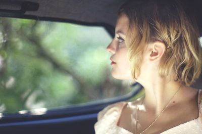 Portrait of teenage girl in car