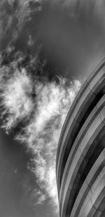 Low angle view of building against cloudy sky