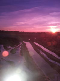 Scenic view of landscape against sky during sunset