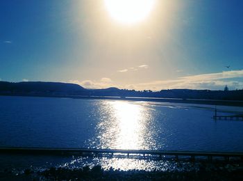 Sun shining over lake