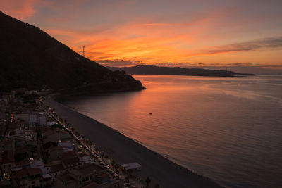 High angle view of bay against sky during sunset