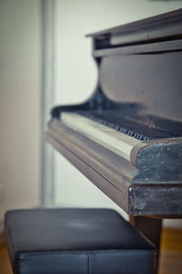 Close-up of piano keys on table at home