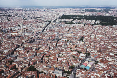 From above aerial drone view shot of city with dense infrastructure