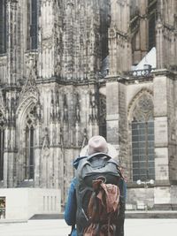 Rear view of woman walking in temple