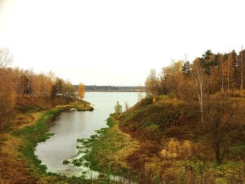 Scenic view of calm lake against clear sky