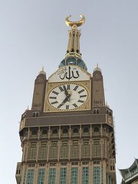 Low angle view of clock tower against sky