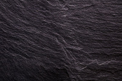 Full frame shot of rock on black background