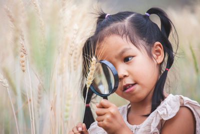 Close-up portrait of a girl looking away