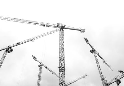 Low angle view of crane against sky
