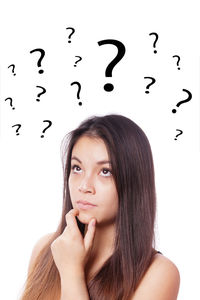 Portrait of beautiful young woman against white background