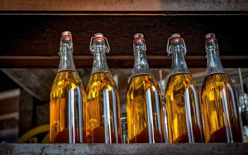 Close-up of yellow bottles
