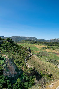 A landscape view of the green mountains and valleys surrounding ronda in southern spain