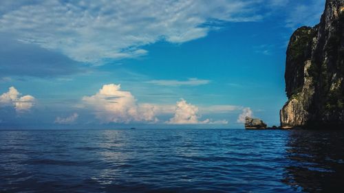 Scenic view of sea against cloudy sky