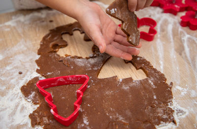 Gingerbread dough for christmas cookies and cookie cutters.