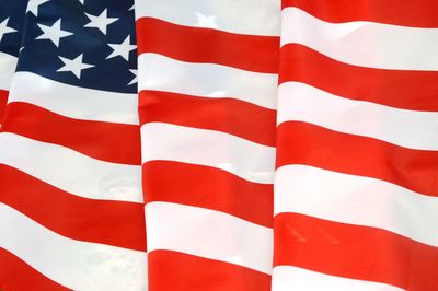 Close-up of flag against blue sky