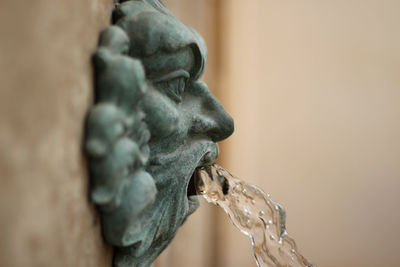 Close-up of water falling from sculpture