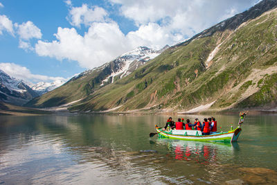 People in boat in lake