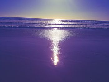 Close-up of water against sky at sunset