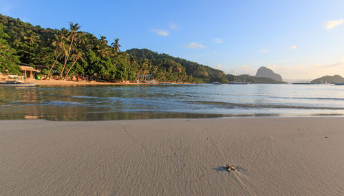 View of calm beach against the sky