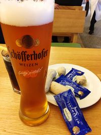 Close-up of beer glass on table