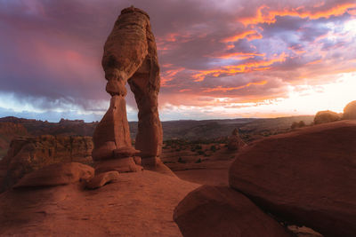 Rock formations against sky during sunset