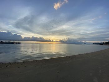 Scenic view of beach against sky during sunset