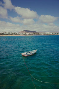 Sailboat in sea against sky