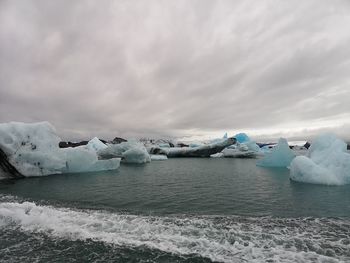 Scenic view of frozen sea against sky