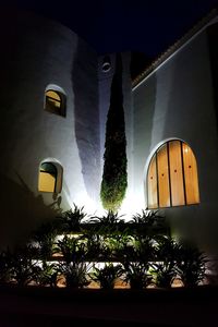 Low angle view of illuminated building at night