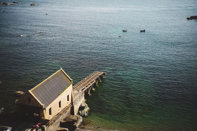 High angle view of building by sea at lizard point in cornwall, england