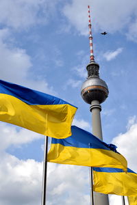 Low angle view of flag against sky