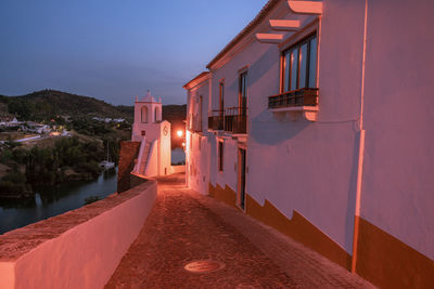 Buildings against sky at night